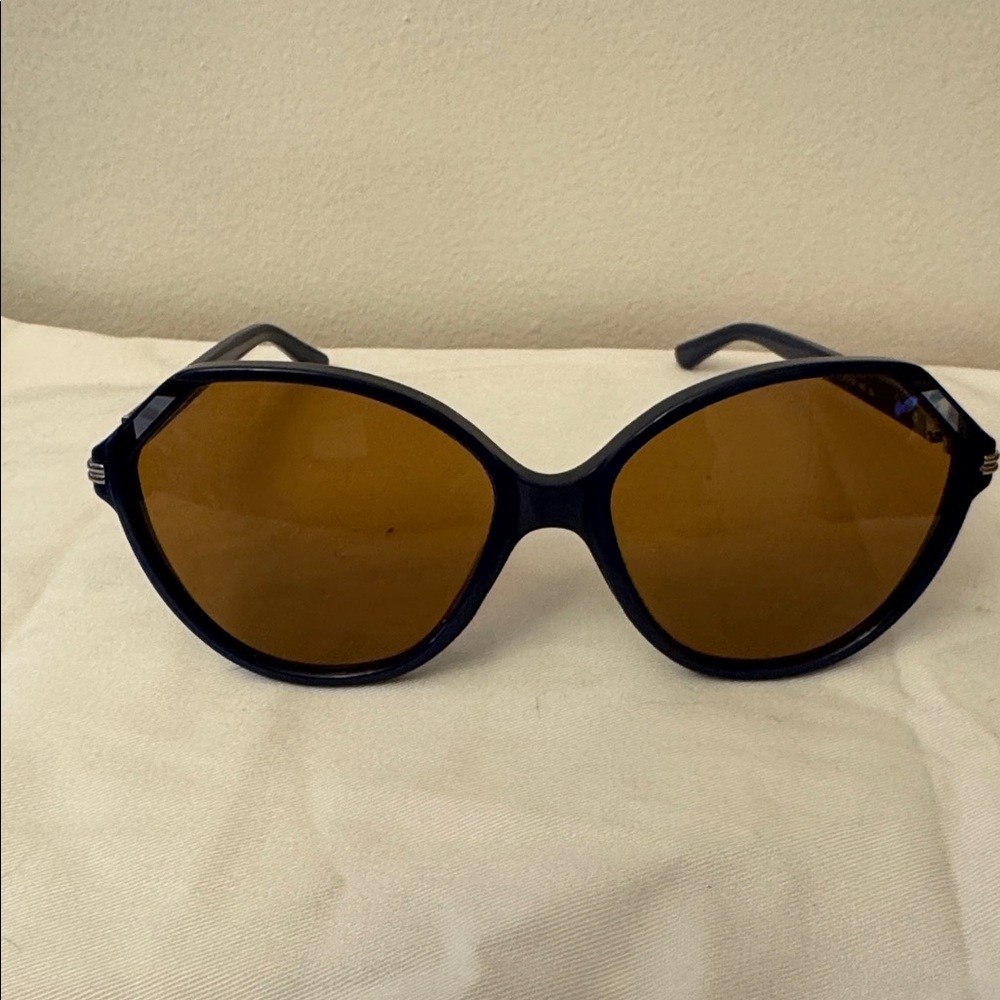 Tory Burch blue frame sunglasses.